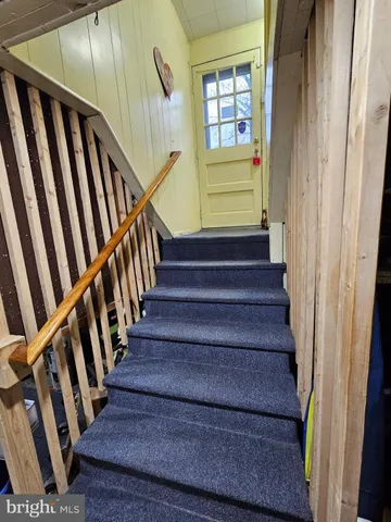 a view of entryway with wooden floor