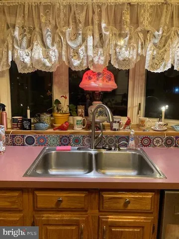 a kitchen with a sink and a stove