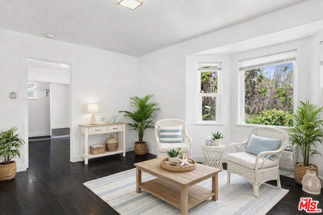 2140 20th Street, Unit A Santa Monica, CA 90405 - Photo 1 of 15 a living room with furniture potted plant and a window