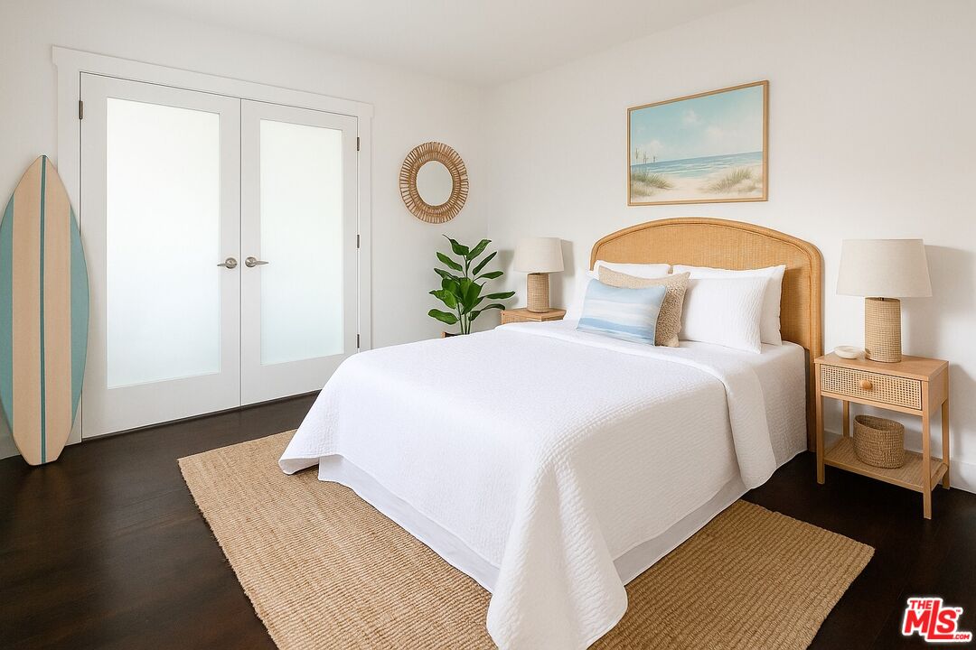 2140 20th Street, Unit A Santa Monica, CA 90405 - Photo 12 of 15 a bedroom with a bed and wooden floor