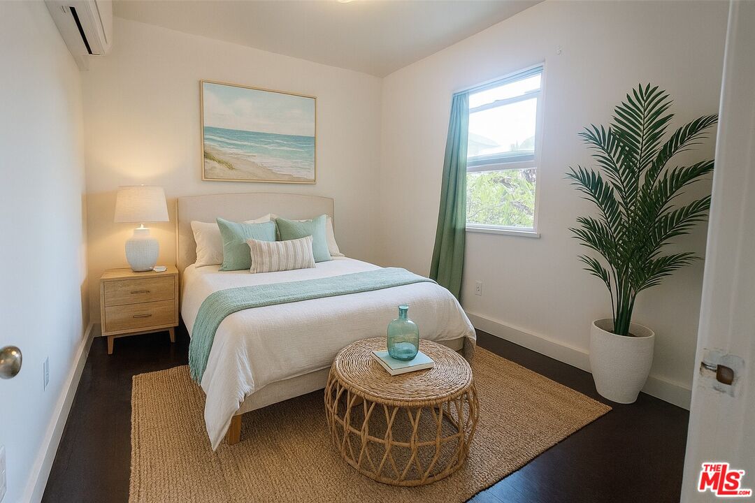 2140 20th Street, Unit A Santa Monica, CA 90405 - Photo 13 of 15 a bedroom with a bed and a potted plant