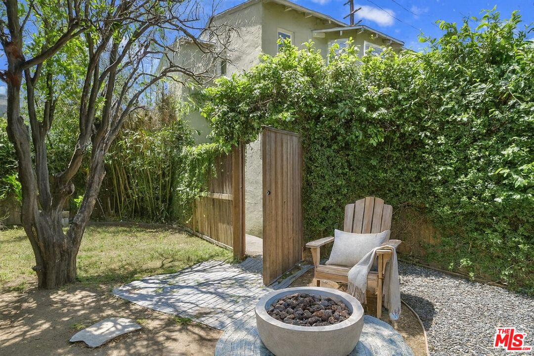 2140 20th Street, Unit A Santa Monica, CA 90405 - Photo 14 of 15 a backyard of a house with fire pit and outdoor seating