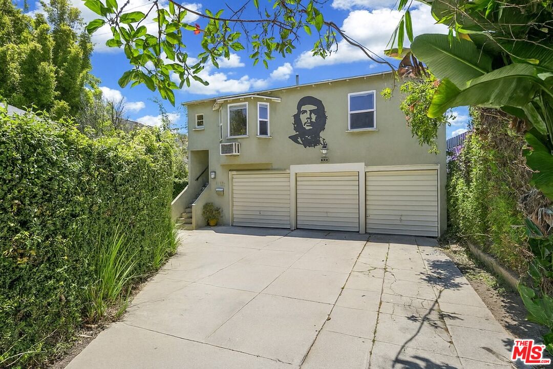 2140 20th Street, Unit A Santa Monica, CA 90405 - Photo 15 of 15 a view of a house with a small yard and plants