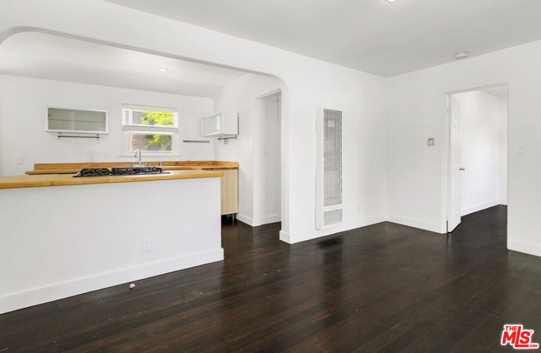 2140 20th Street, Unit A Santa Monica, CA 90405 - Photo 3 of 15 a view of a kitchen with wooden floor and a sink