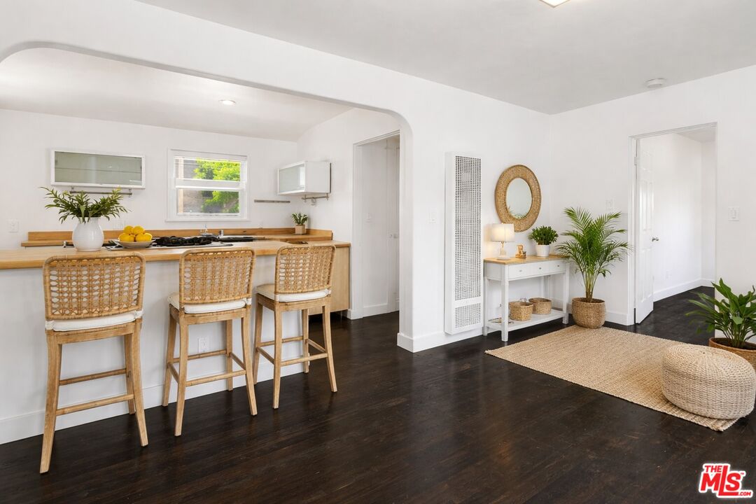 2140 20th Street, Unit A Santa Monica, CA 90405 - Photo 4 of 15 a living room with furniture wooden floor and a large window