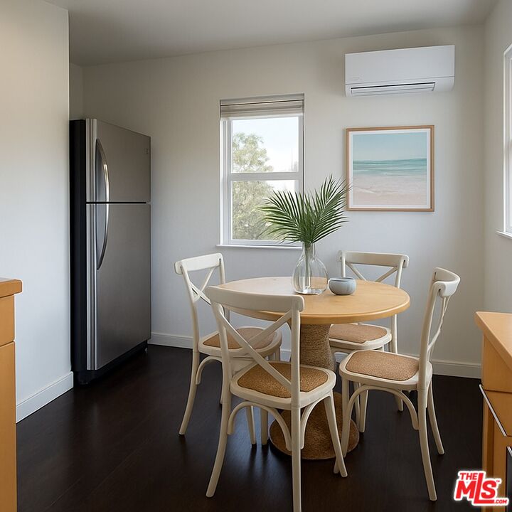 2140 20th Street, Unit A Santa Monica, CA 90405 - Photo 8 of 15 a dining room with furniture and wooden floor