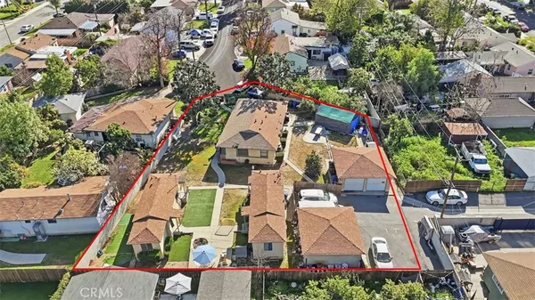 an aerial view of residential houses with outdoor space