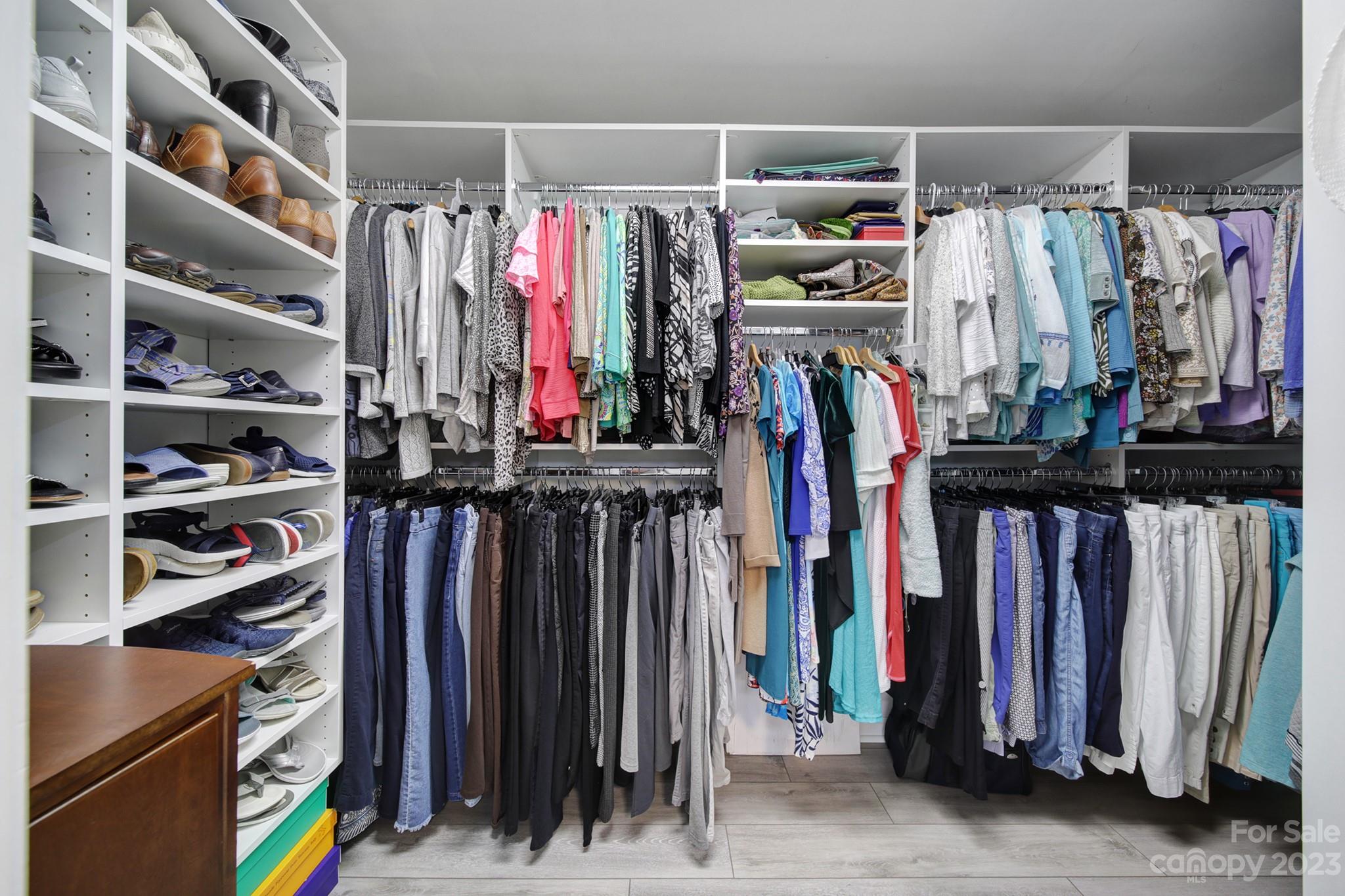 4028 Windward Drive Tega Cay, SC 29708 - Photo 26 of 48 a view of walk in closet with clothes and shoes