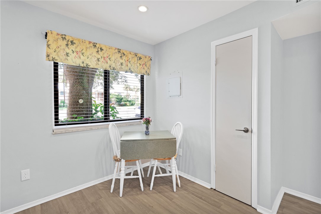 9645 Estuary Way, Unit 1 Sebastian, FL 32958 - Photo 12 of 36 a dining room with furniture and wooden floor