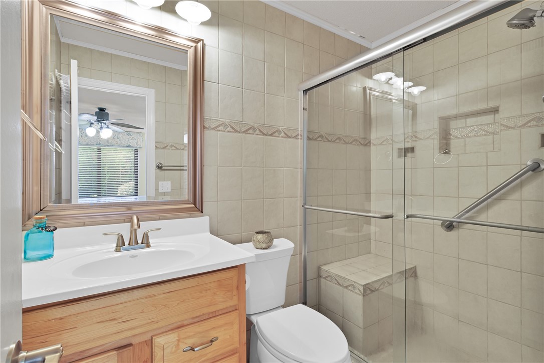 9645 Estuary Way, Unit 1 Sebastian, FL 32958 - Photo 17 of 36 a bathroom with a sink toilet and shower