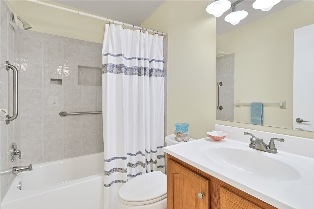 9645 Estuary Way, Unit 1 Sebastian, FL 32958 - Photo 21 of 36 a bathroom with a granite countertop sink toilet and shower