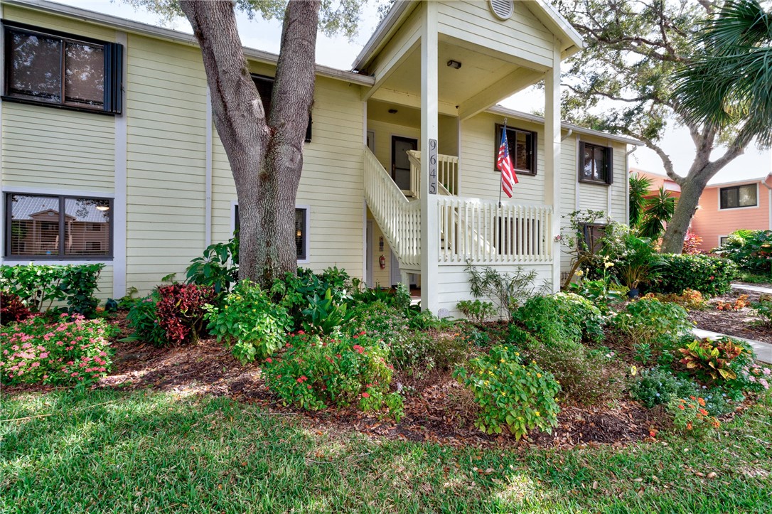 9645 Estuary Way, Unit 1 Sebastian, FL 32958 - Photo 27 of 36 a front view of a house with garden