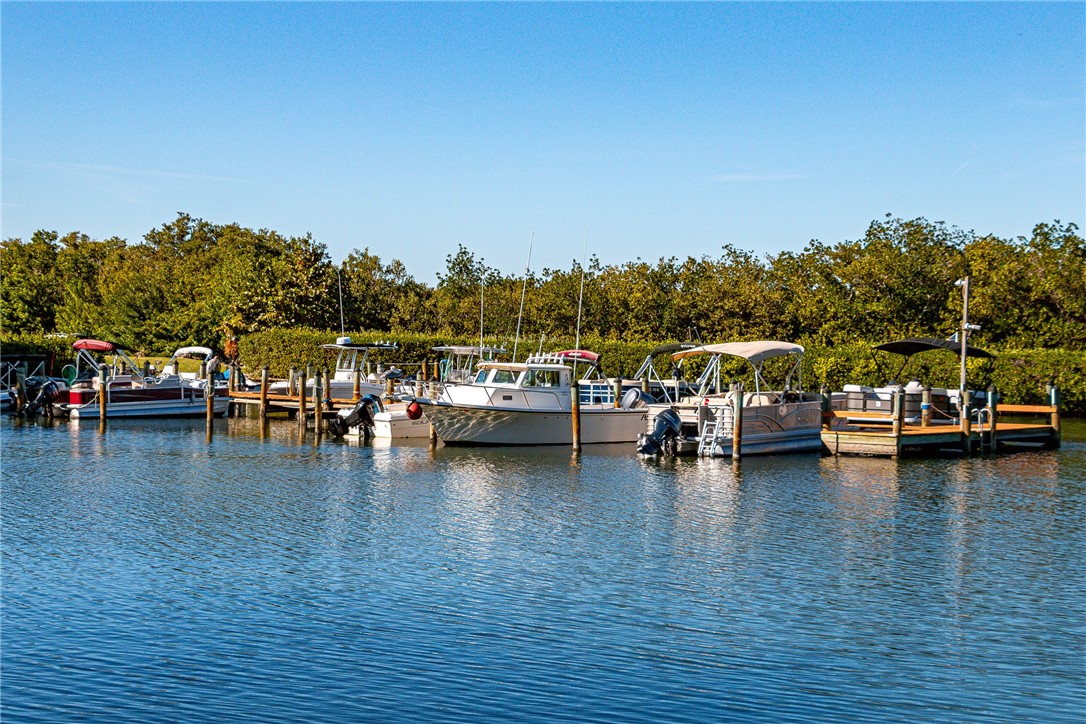 9645 Estuary Way, Unit 1 Sebastian, FL 32958 - Photo 32 of 36 a view of a lake with boats and trees
