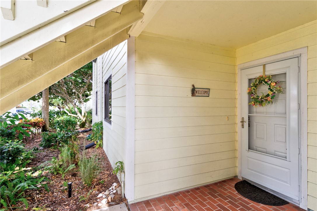 9645 Estuary Way, Unit 1 Sebastian, FL 32958 - Photo 4 of 36 a view of door and yard
