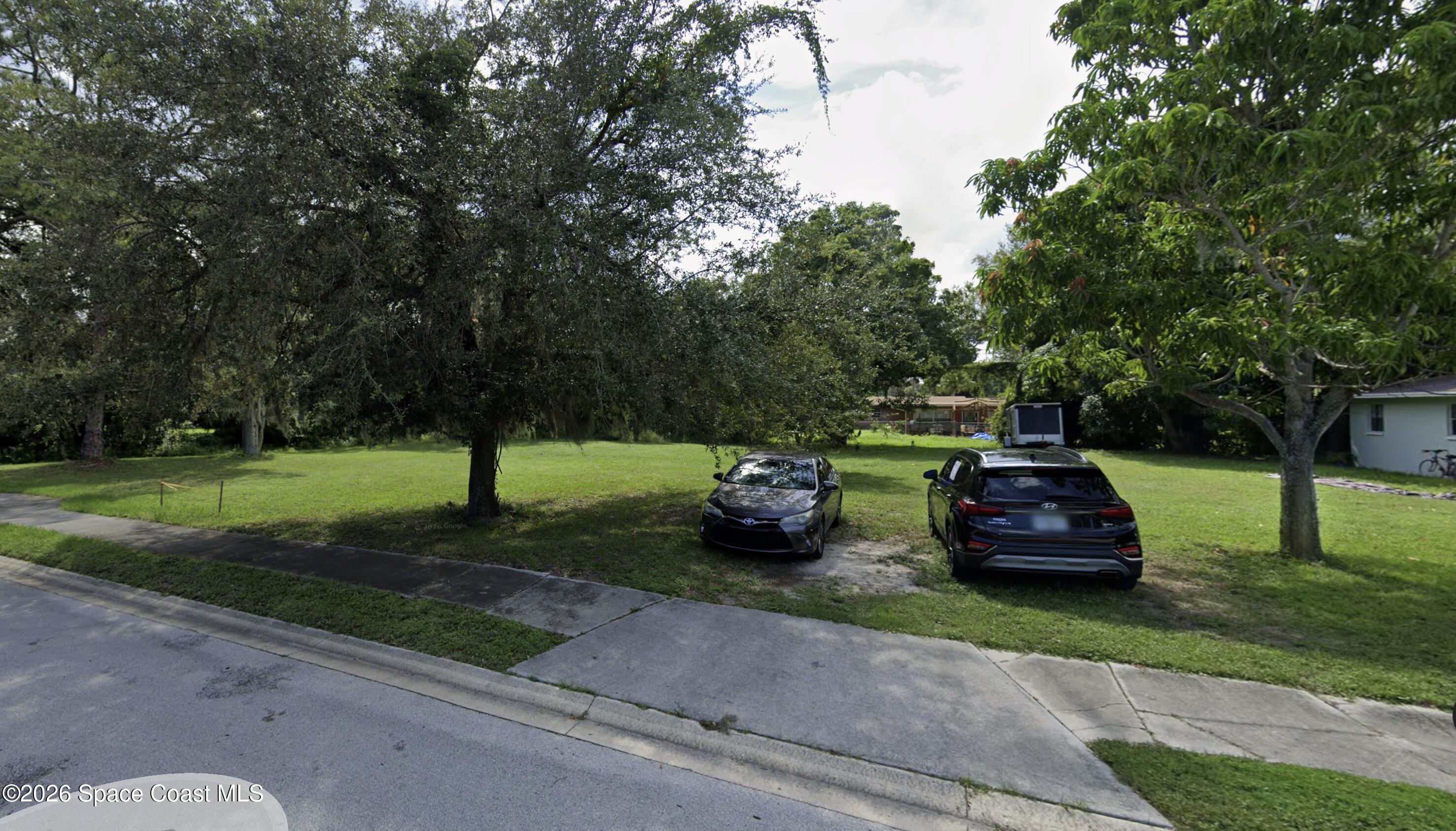 0 South Georgia Avenue Cocoa, FL 32922 - Photo 4 of 6 a front view of a house with garden and trees