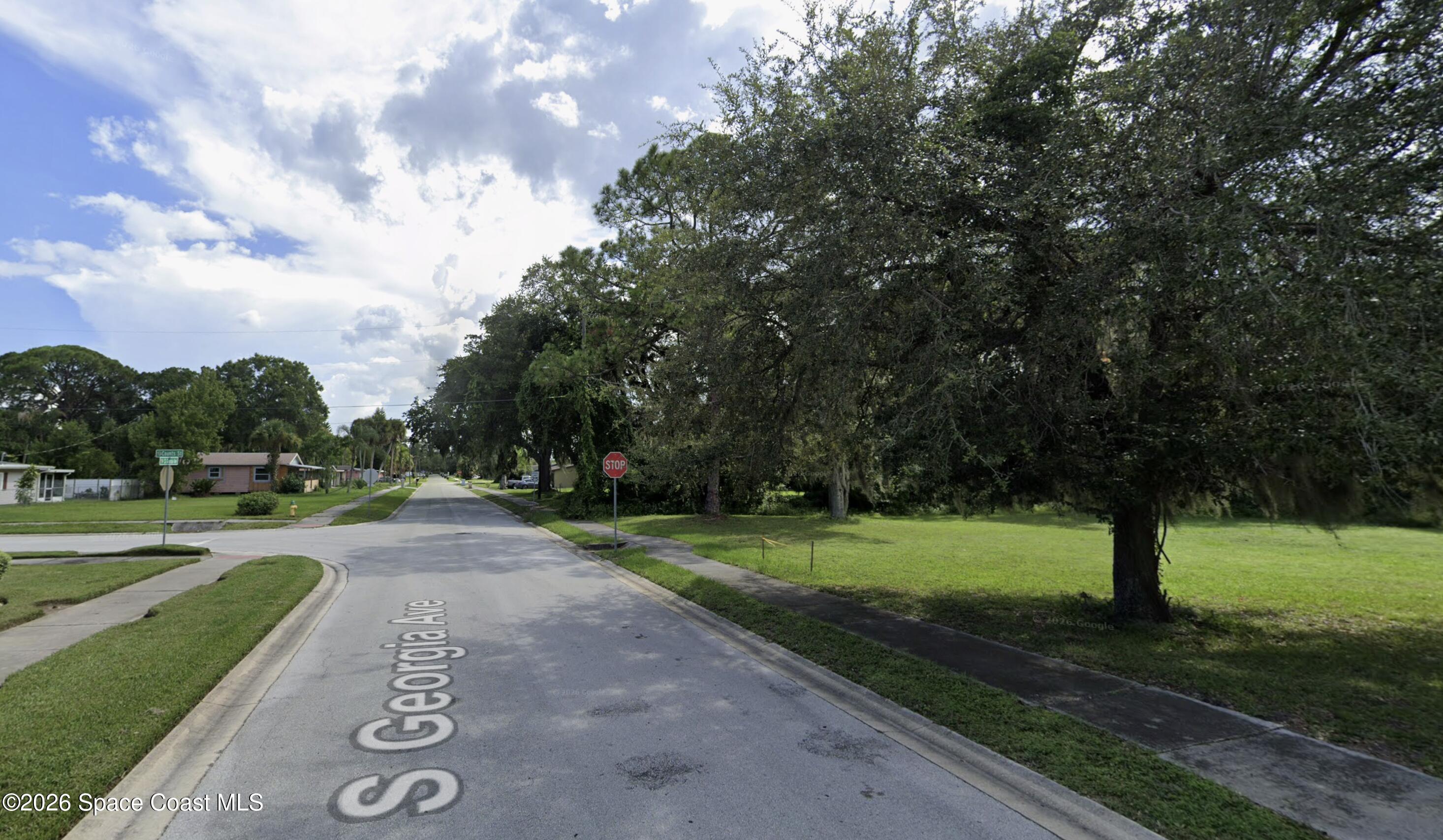 0 South Georgia Avenue Cocoa, FL 32922 - Photo 5 of 6 a view of a street with a yard and a trees