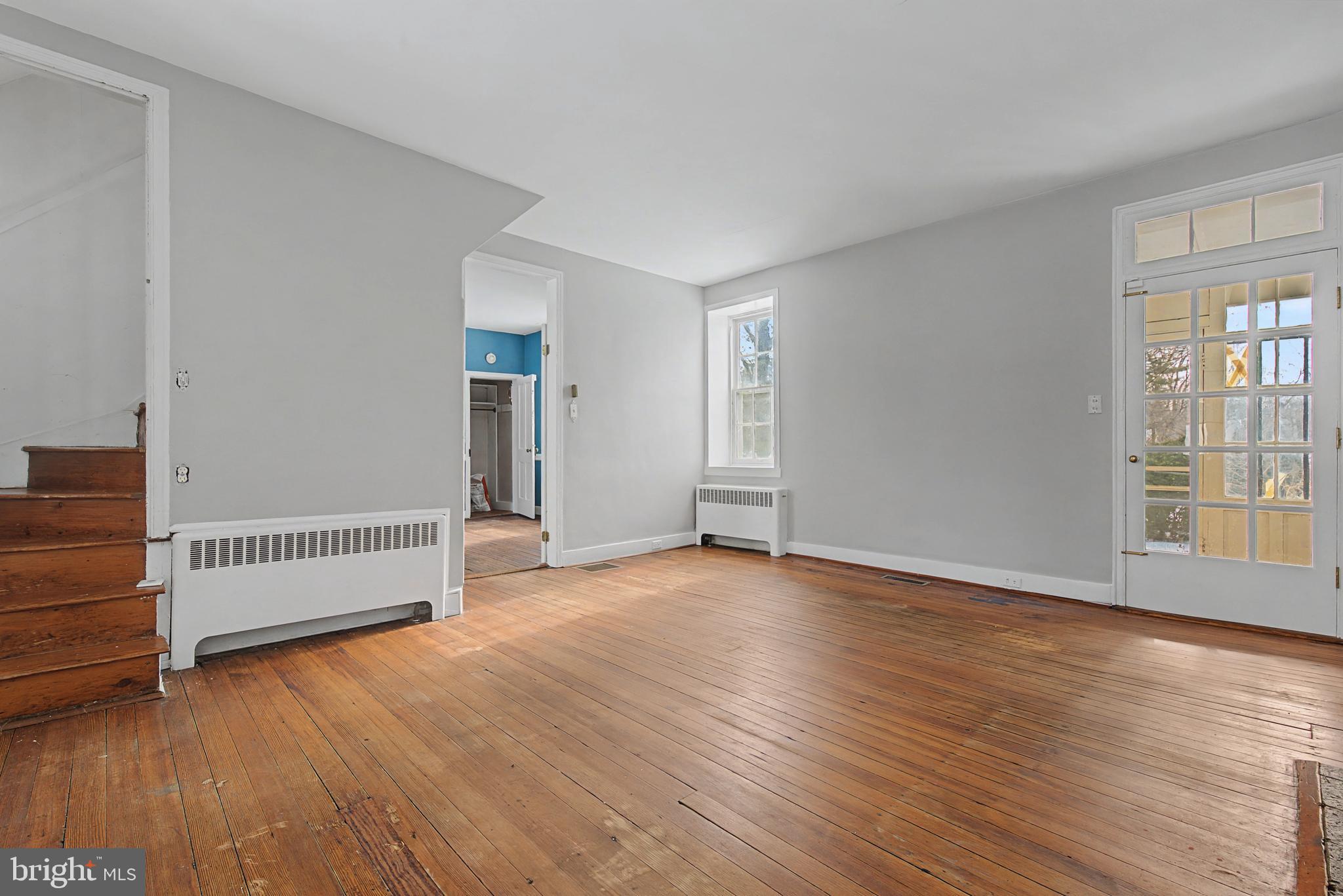 1776 Atlas Drive Frederick, MD 21702 - Photo 23 of 54 an empty room with wooden floor and windows