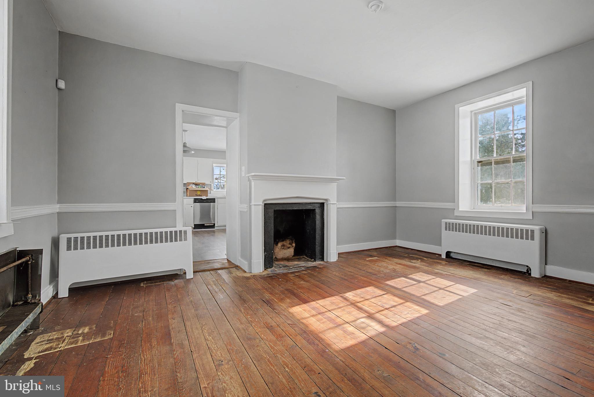 1776 Atlas Drive Frederick, MD 21702 - Photo 24 of 54 a view of a room with wooden floor fireplace and windows