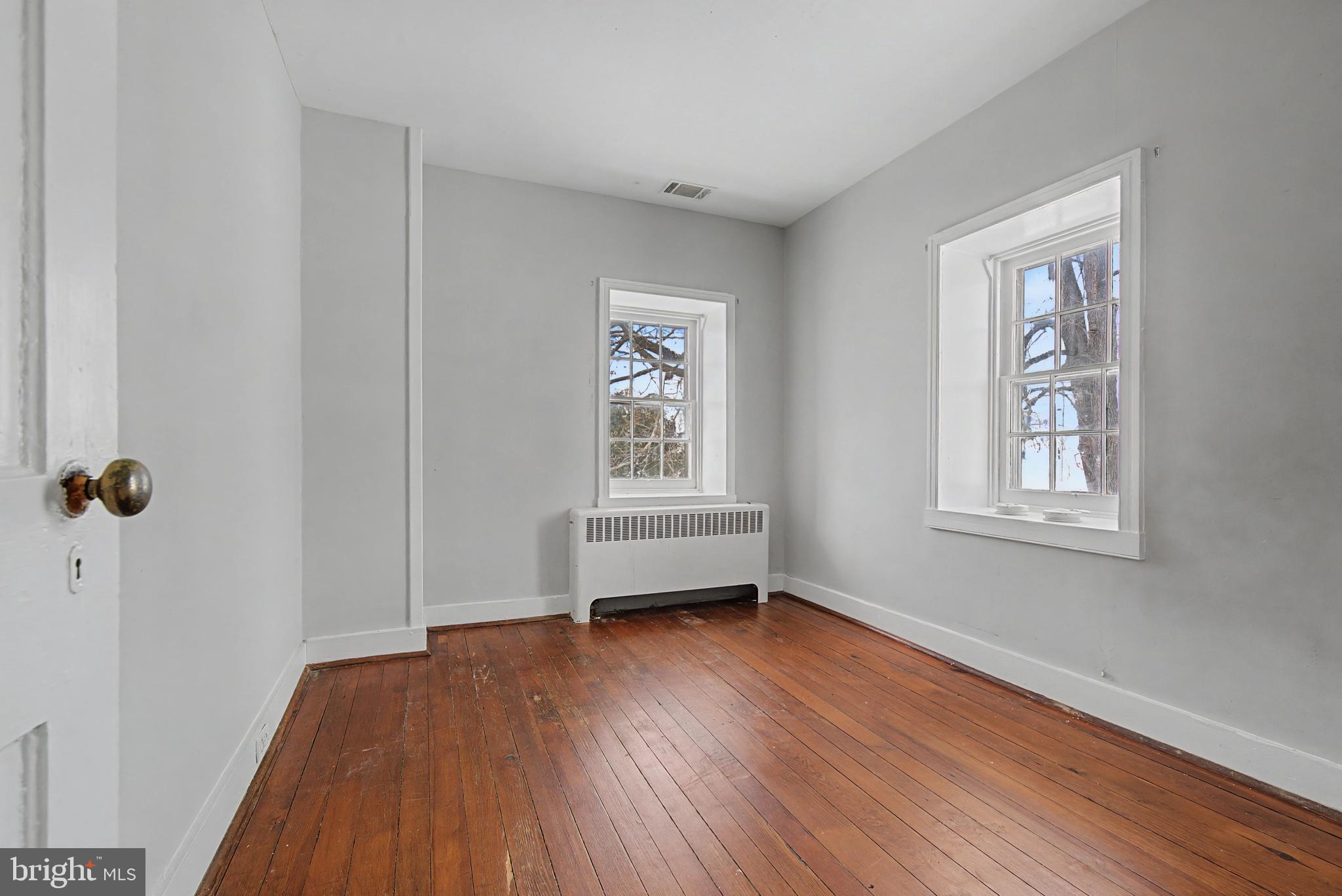 1776 Atlas Drive Frederick, MD 21702 - Photo 28 of 54 a view of empty room with wooden floor and fan