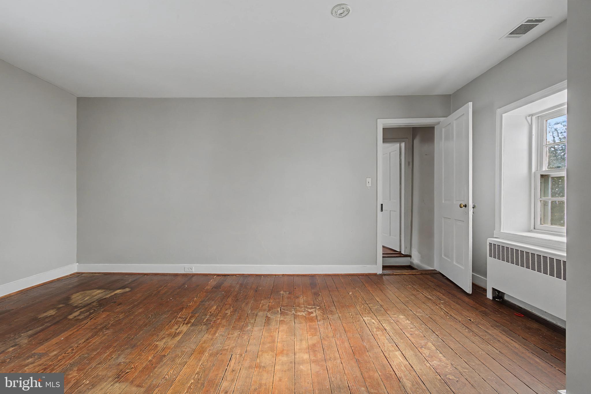 1776 Atlas Drive Frederick, MD 21702 - Photo 32 of 54 a view of an empty room with wooden floor and windows