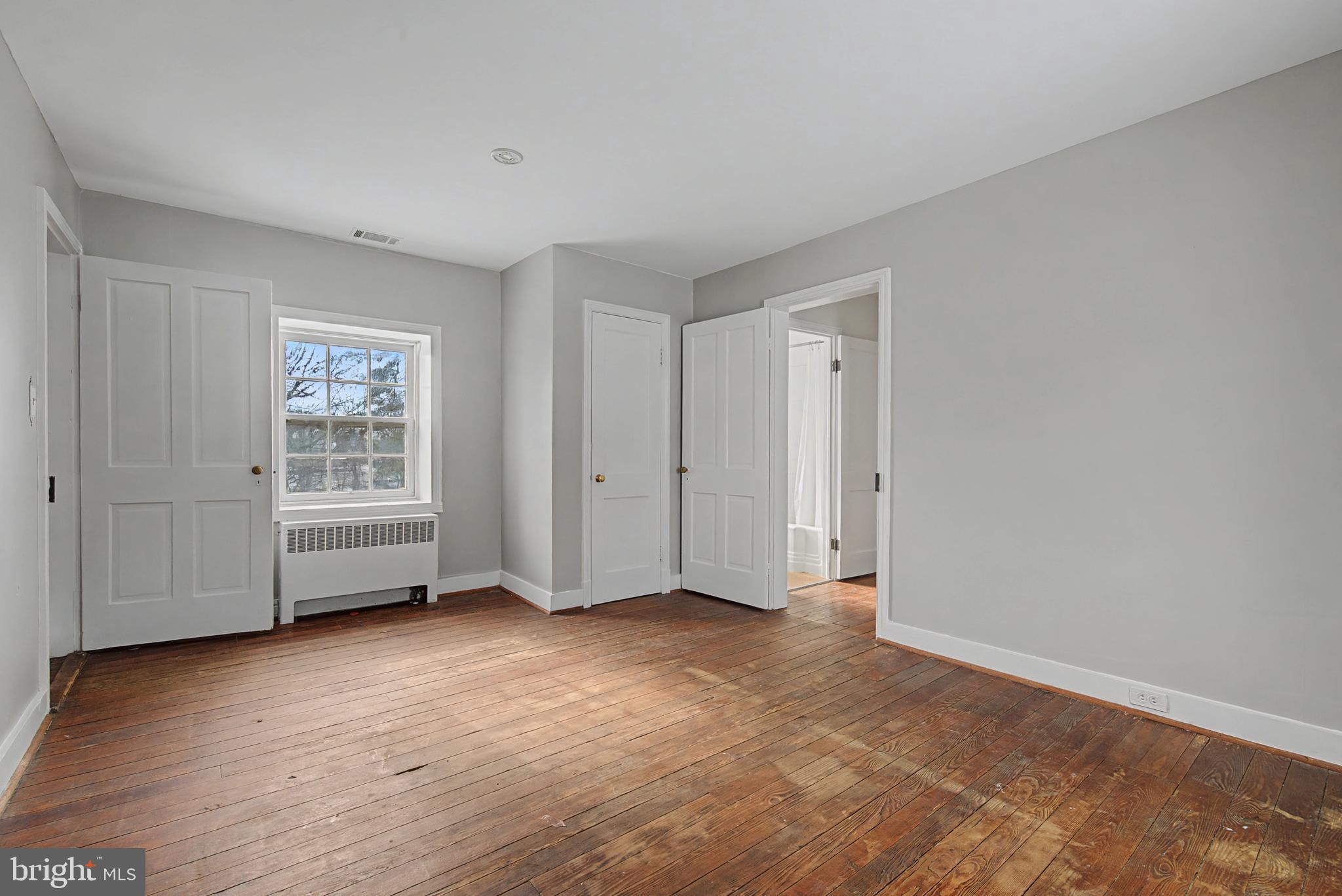 1776 Atlas Drive Frederick, MD 21702 - Photo 34 of 54 a view of an empty room with wooden floor and window