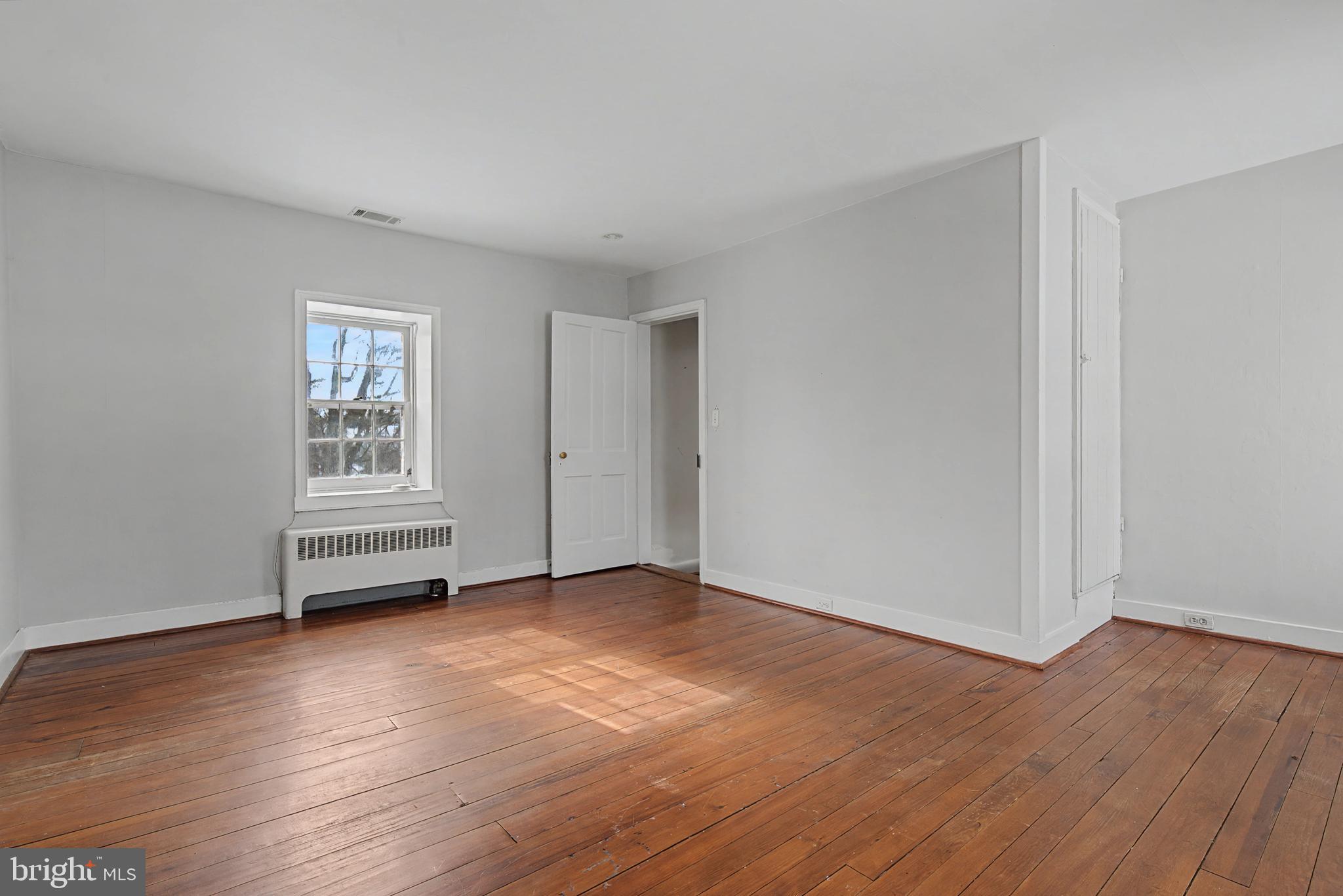 1776 Atlas Drive Frederick, MD 21702 - Photo 36 of 54 a view of empty room with wooden floor and window