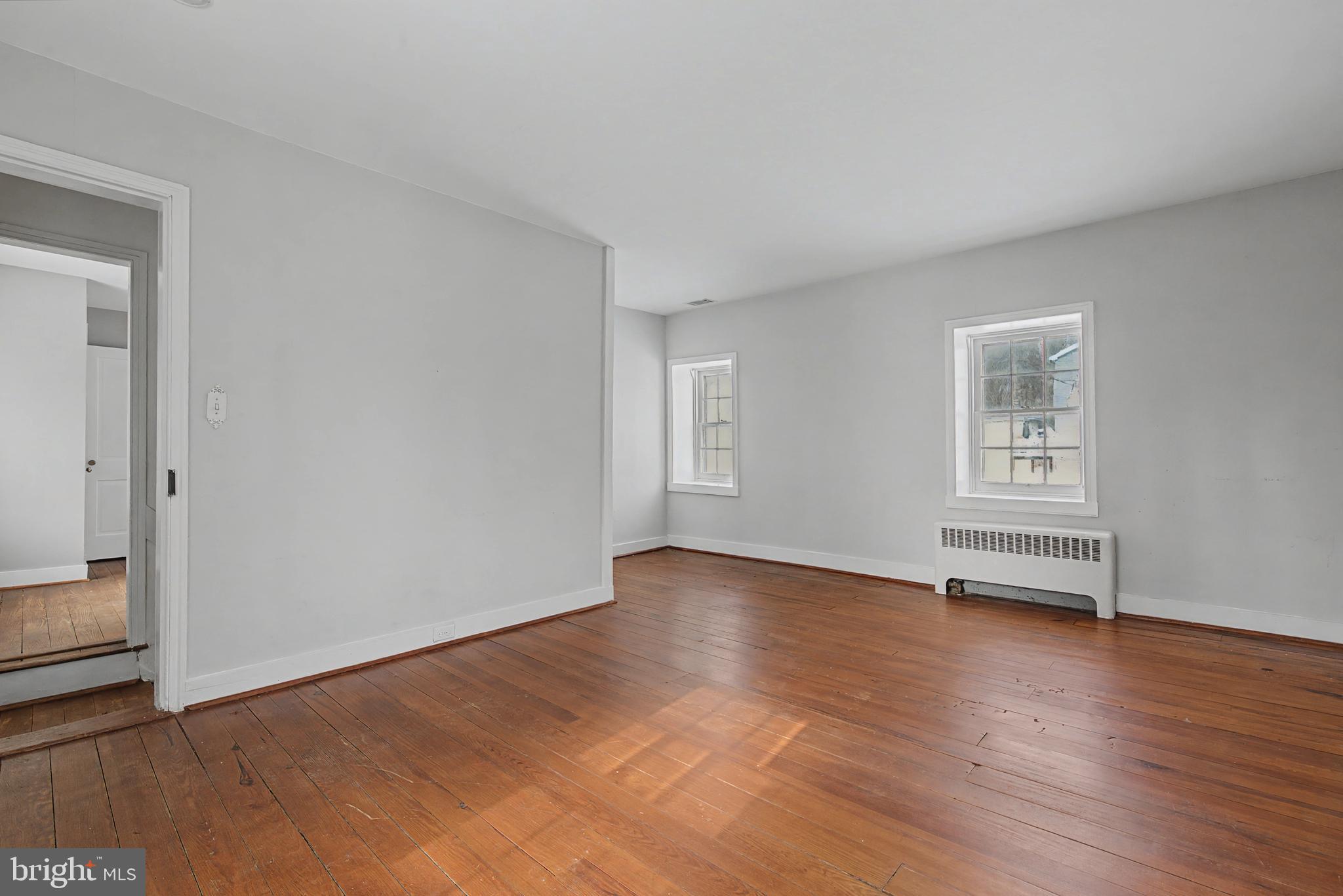 1776 Atlas Drive Frederick, MD 21702 - Photo 37 of 54 an empty room with wooden floor and windows