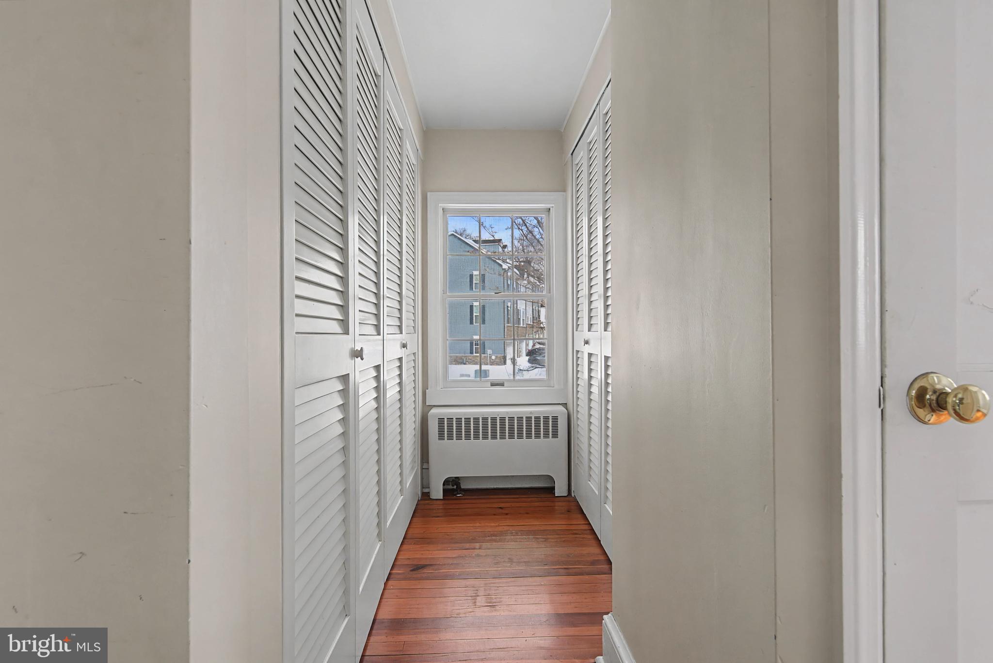 1776 Atlas Drive Frederick, MD 21702 - Photo 41 of 54 a view of a hallway with wooden floor and glass door