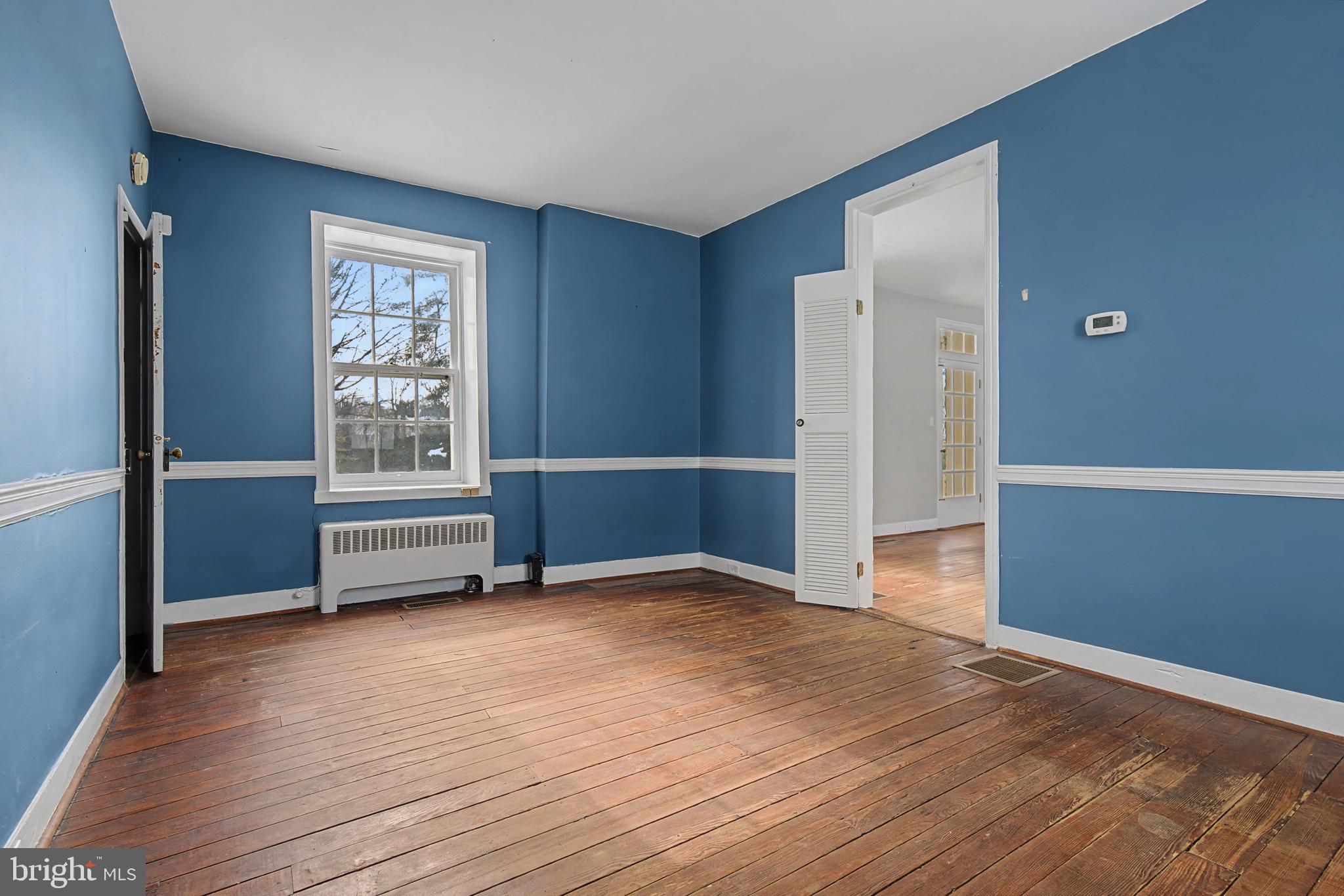 1776 Atlas Drive Frederick, MD 21702 - Photo 43 of 54 an empty room with wooden floor and windows
