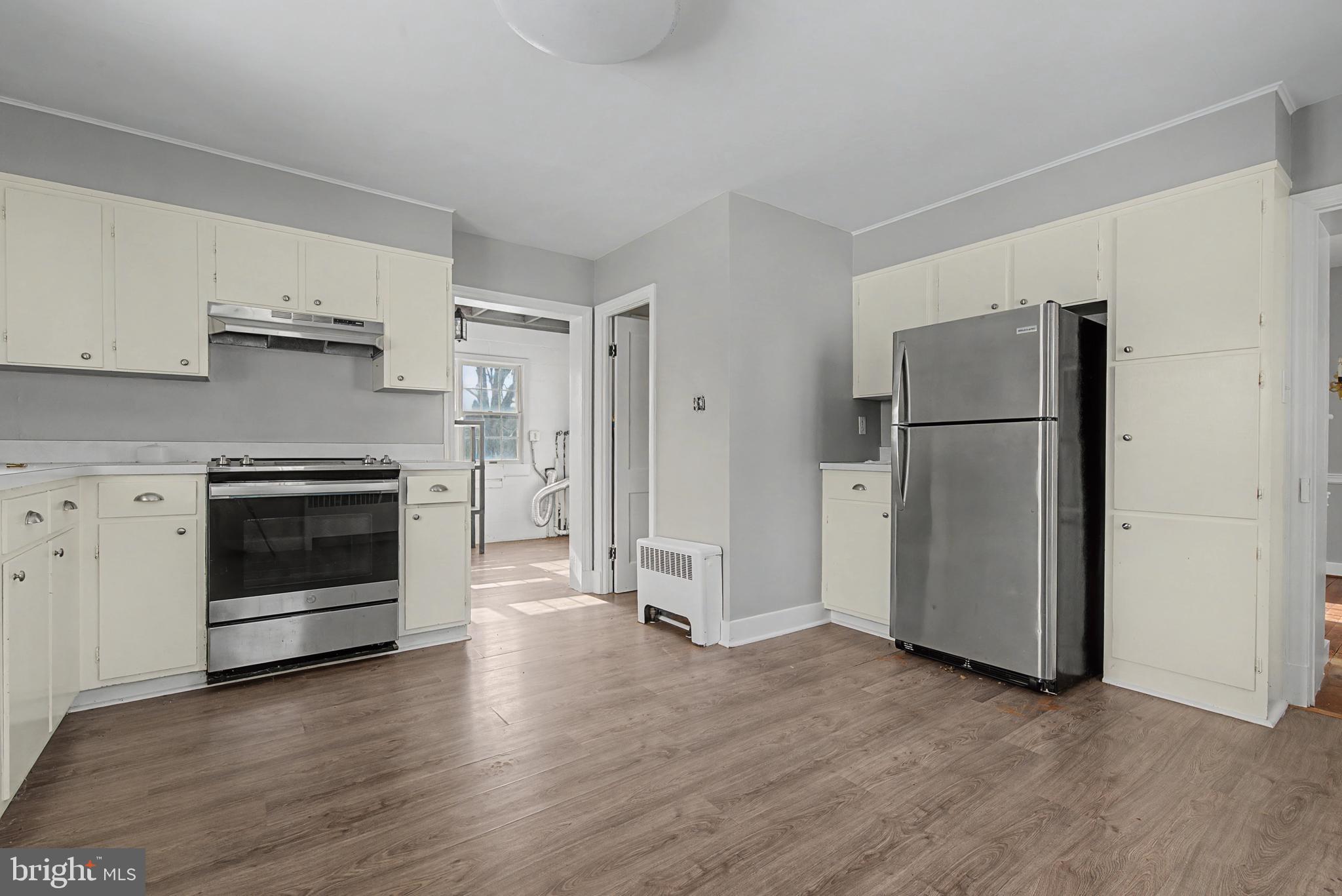 1776 Atlas Drive Frederick, MD 21702 - Photo 44 of 54 a kitchen with a refrigerator and a stove top oven