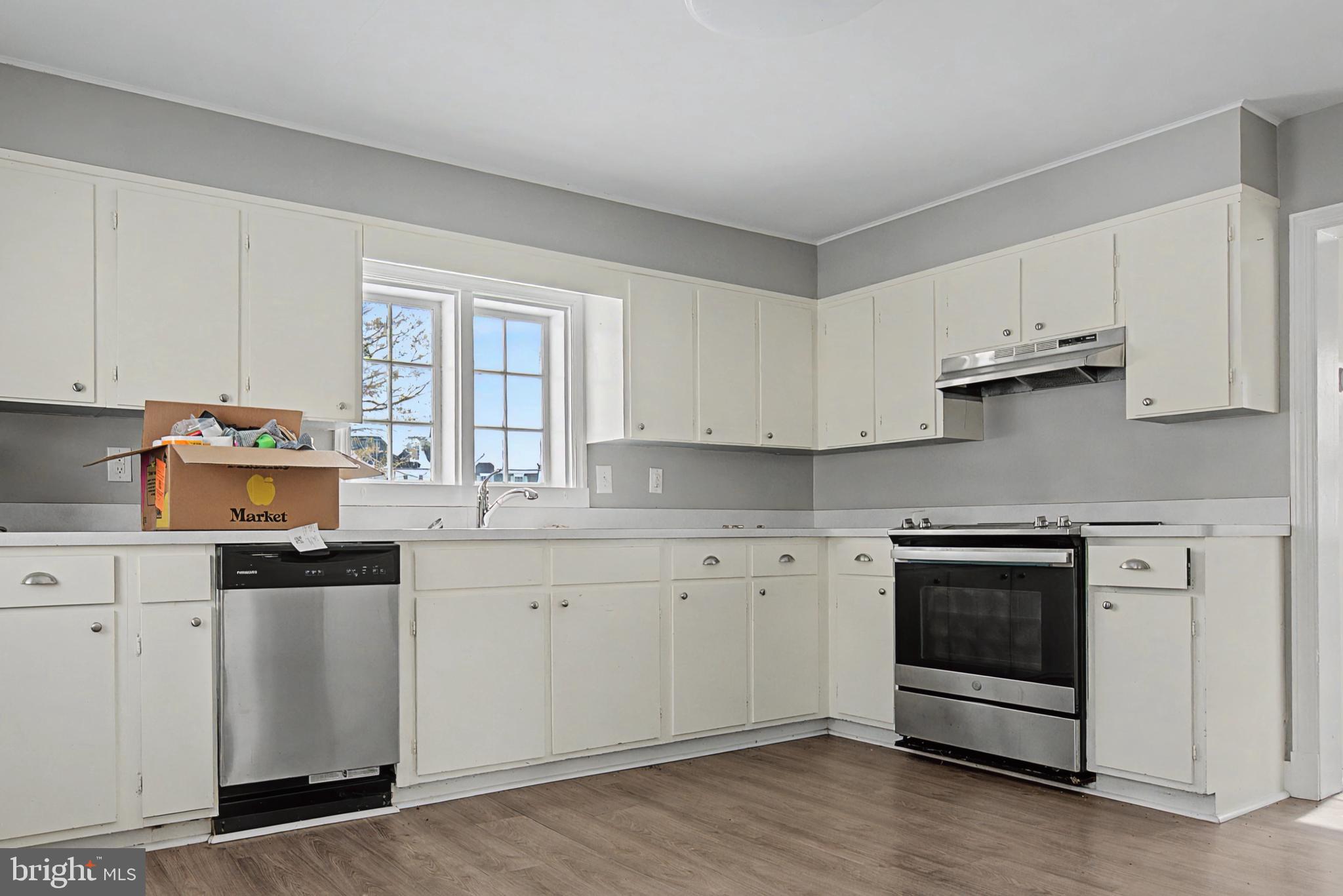 1776 Atlas Drive Frederick, MD 21702 - Photo 46 of 54 a kitchen with stainless steel appliances granite countertop a stove a sink and a microwave