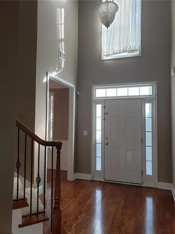 a view of entryway with wooden floor