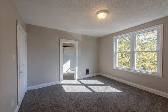 a view of empty room with a window
