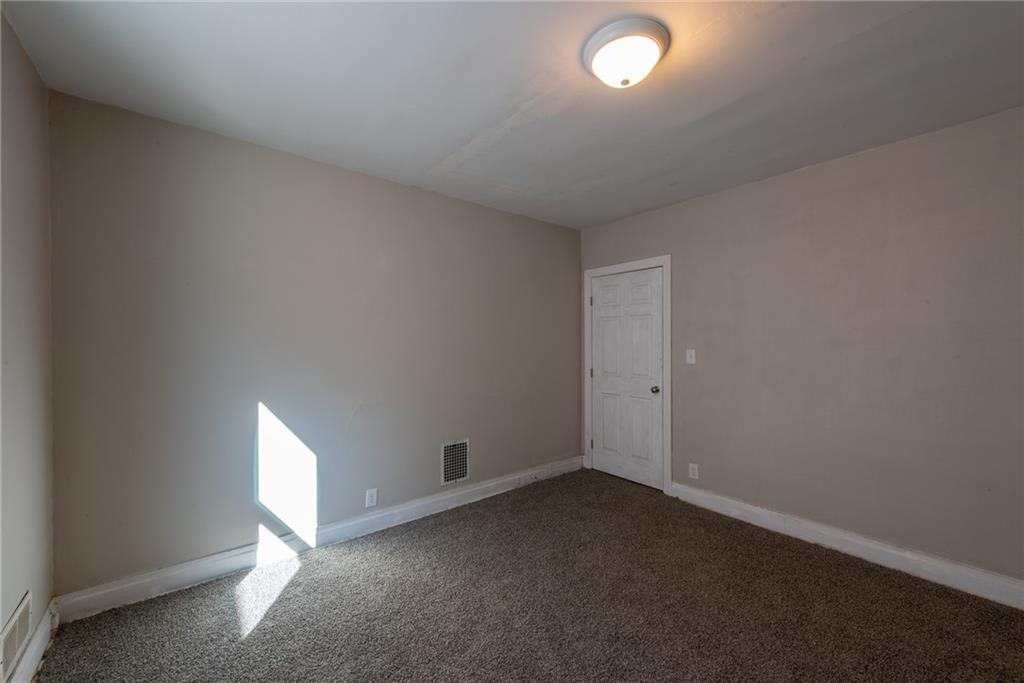 112 Farragut Avenue Vandergrift, PA 15690 - Photo 22 of 36 an empty room with a empty space and windows