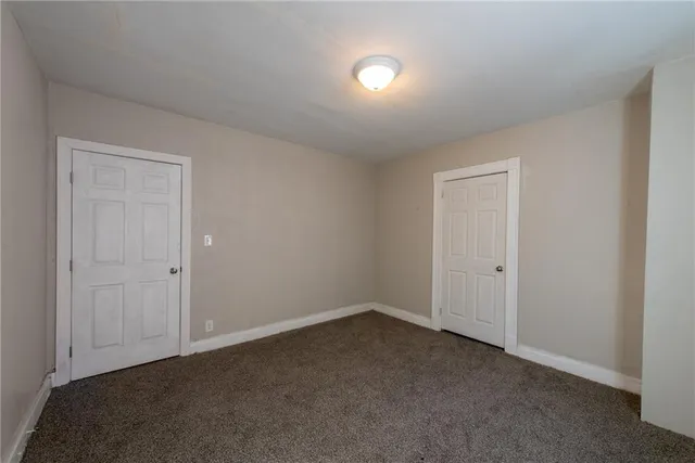 a view of an empty room and entryway