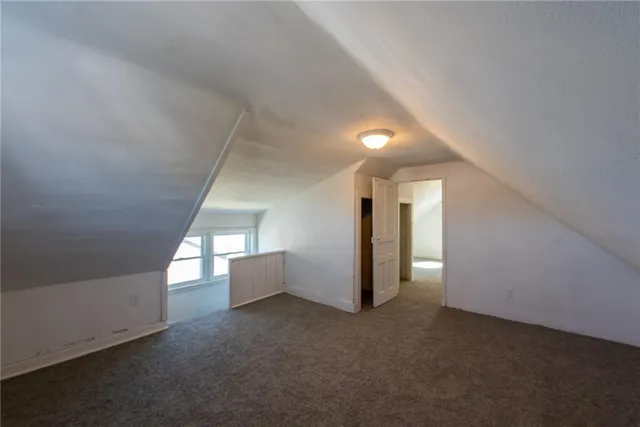 a view of an empty room and a window