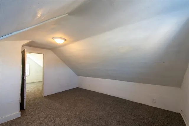 an empty room with a empty space and windows