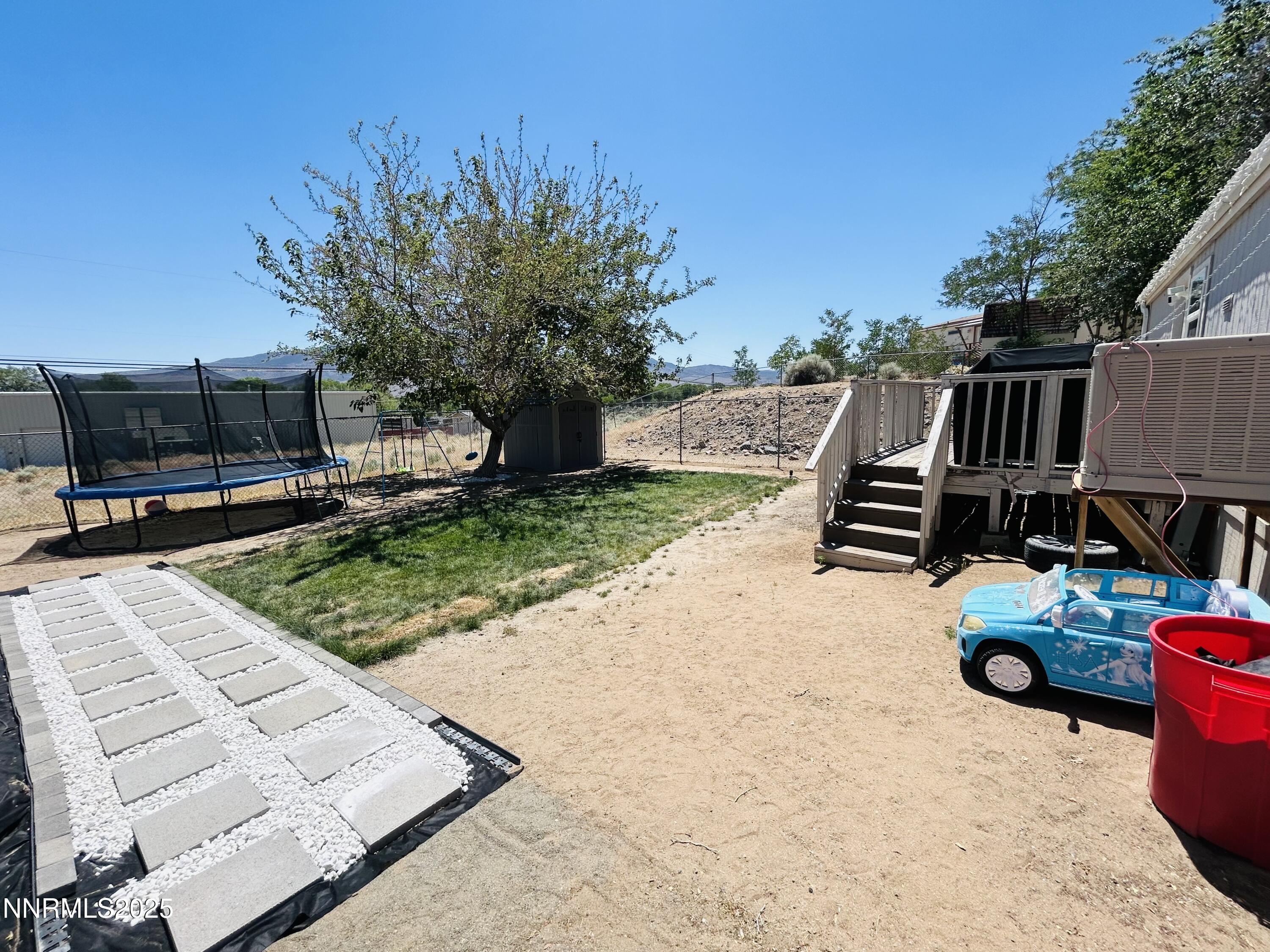 16 Stope Road Dayton, NV 89403 - Photo 19 of 21 a view of backyard with seating space and trees