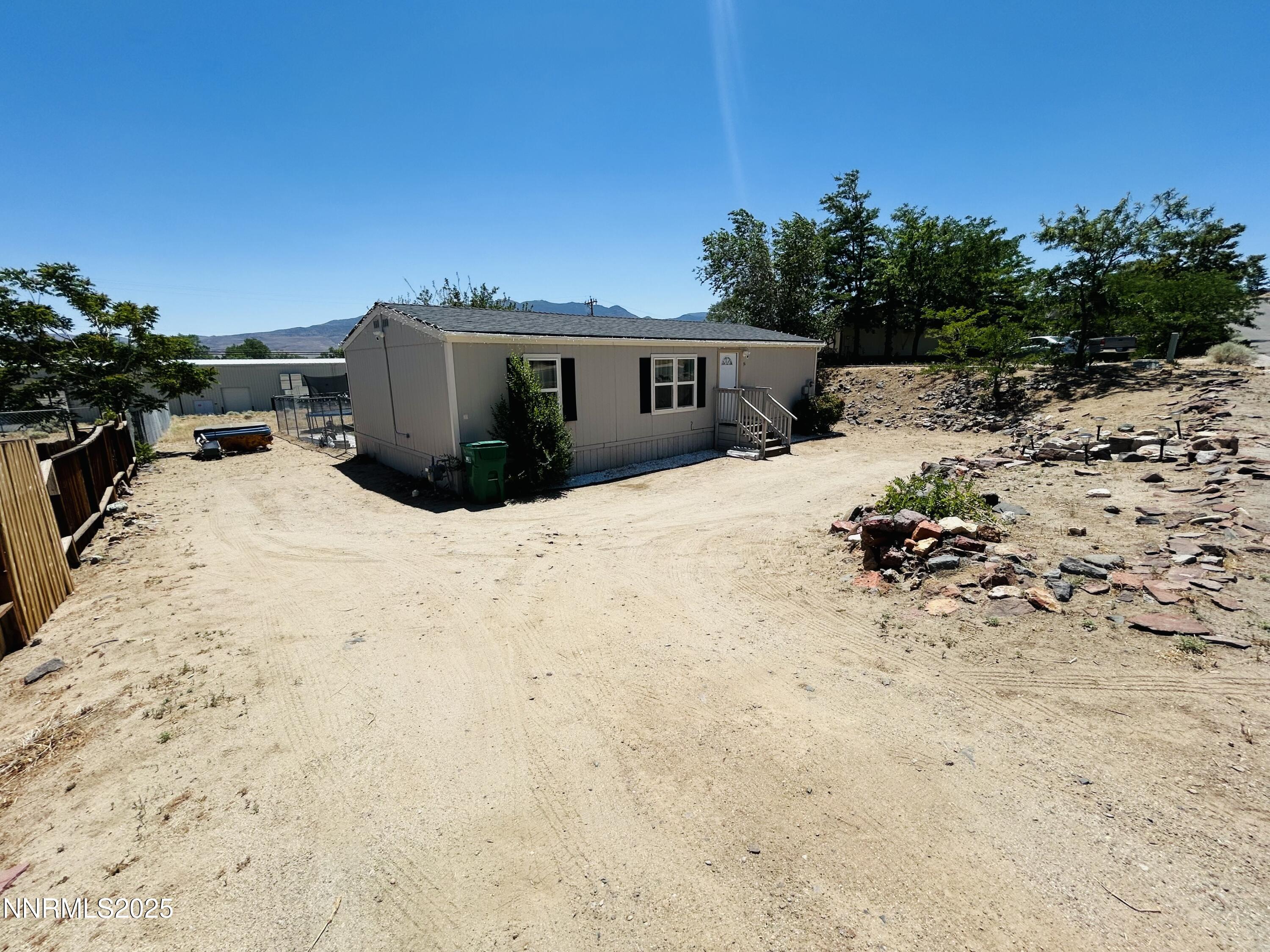 16 Stope Road Dayton, NV 89403 - Photo 4 of 21 a view of a house with a snow in the yard