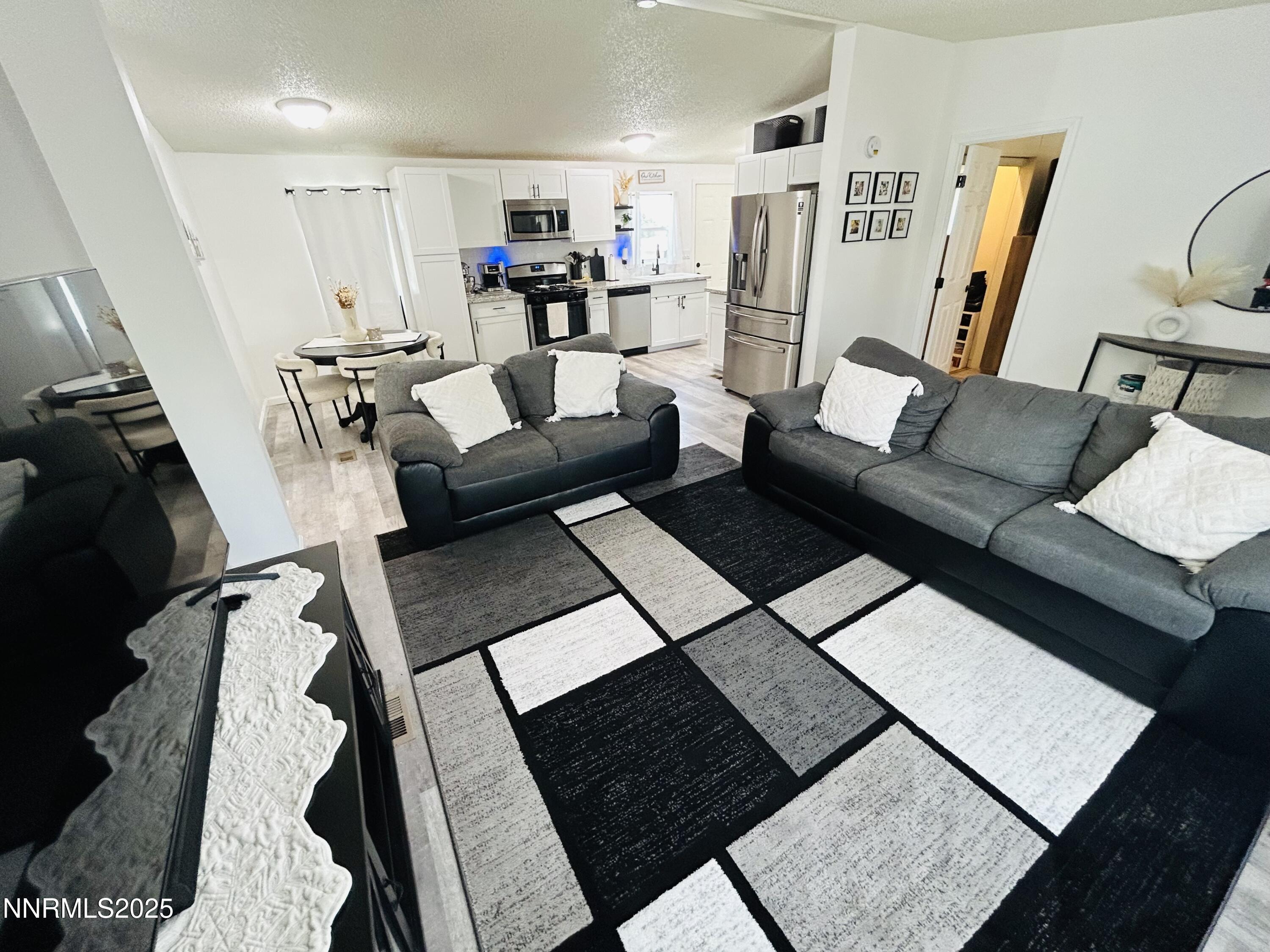 16 Stope Road Dayton, NV 89403 - Photo 8 of 21 a living room with furniture and a rug