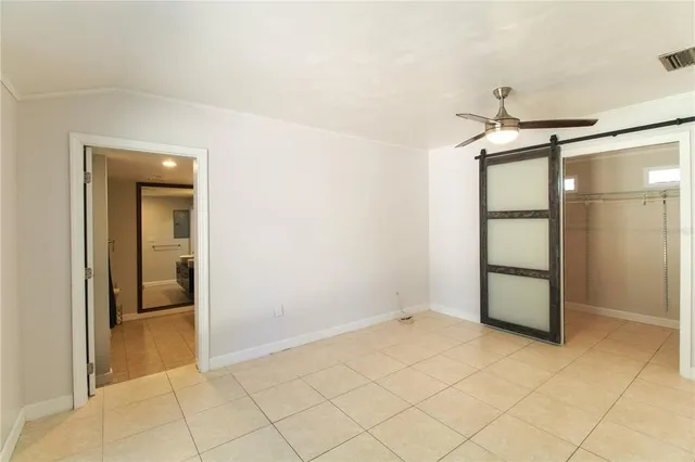 an empty room with a bathroom and a sink