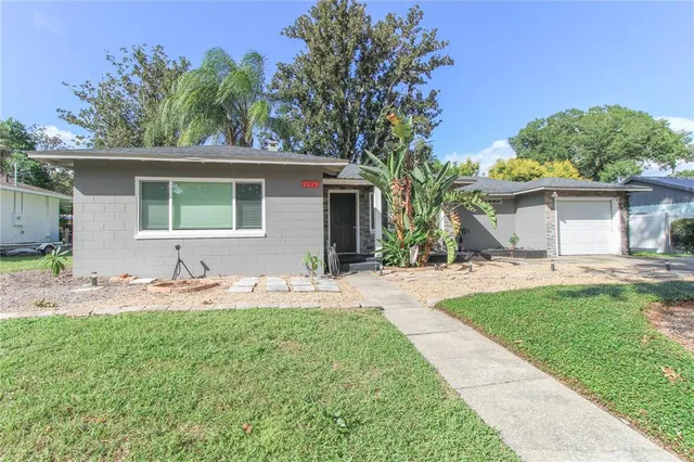 a front view of house with yard and green space