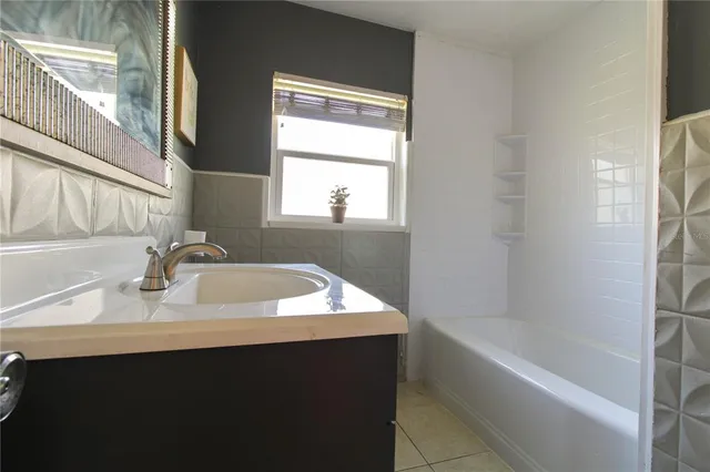 a bathroom with a sink and a bathtub