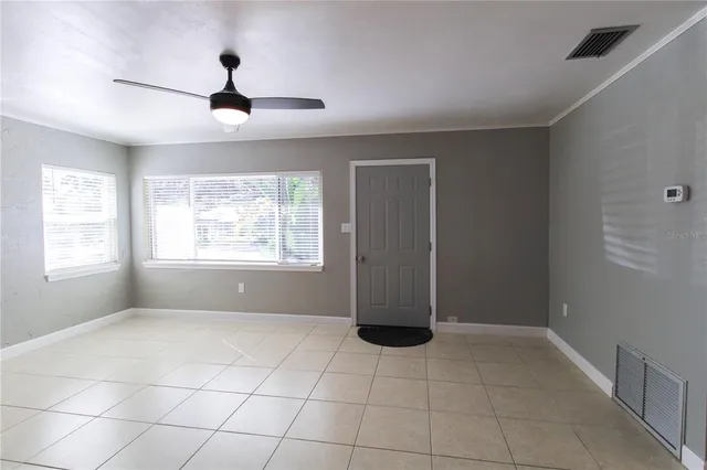 a view of an empty room with a window