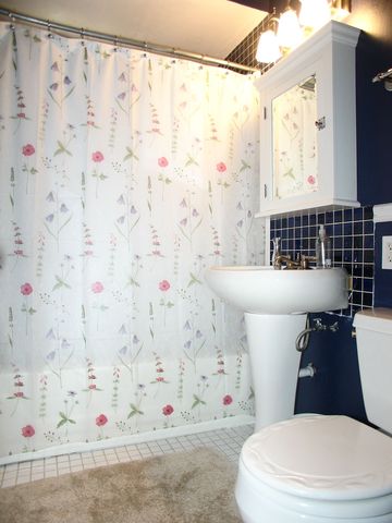 376 Addison Road Riverside, IL 60546 - Photo 11 of 18 a white toilet sitting next to a bathroom sink