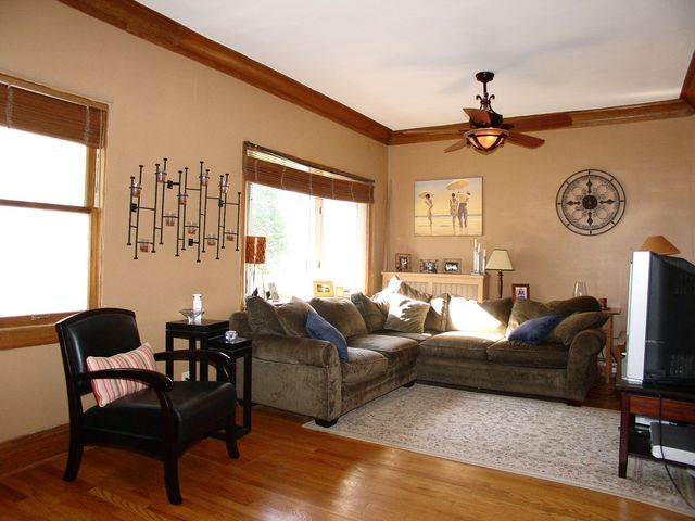 376 Addison Road Riverside, IL 60546 - Photo 4 of 18 a living room with furniture a clock and a window