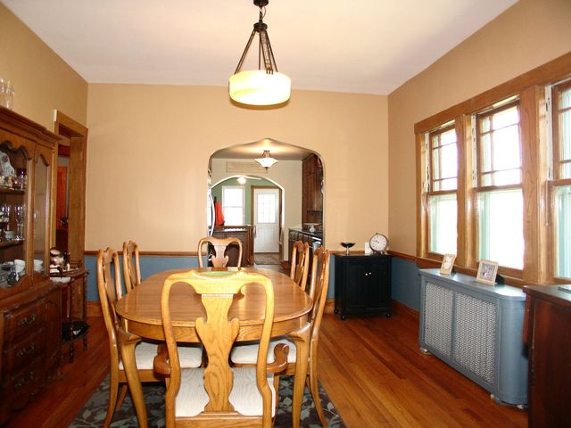 376 Addison Road Riverside, IL 60546 - Photo 7 of 18 a view of a dining room with furniture a chandelier and wooden floor