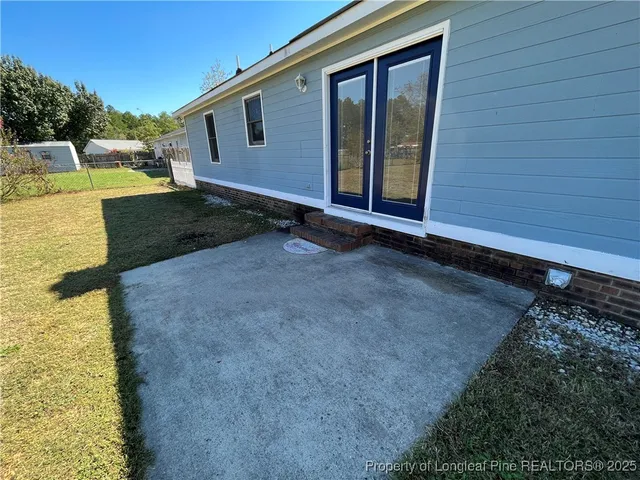 a view of backyard with seating space