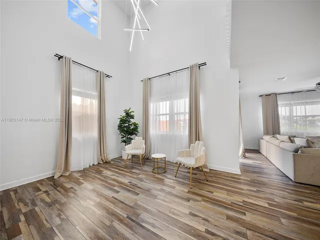a kitchen with a refrigerator and a sink