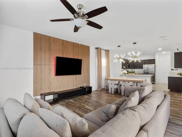 a kitchen with stainless steel appliances a stove sink microwave and cabinets
